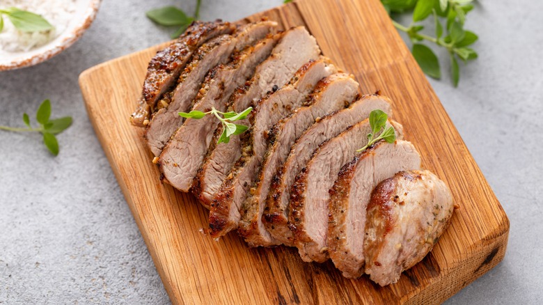 Sliced pork chop on board