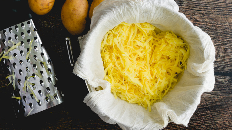 Shredded potatoes in a cheesecloth