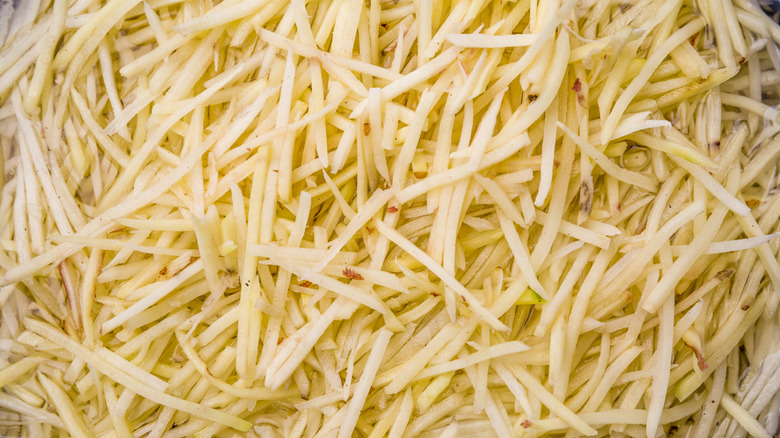 A closeup of shredded potatoes