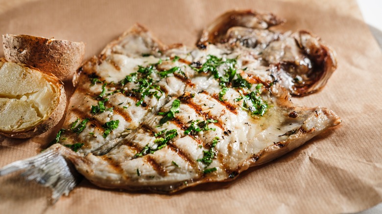 Grilled fish on parchment paper