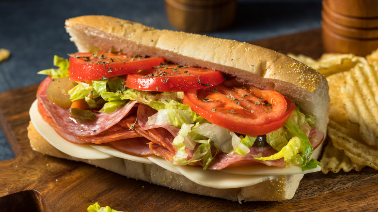 Italian hoagie with provolone cheese, cold cuts, lettuce, tomato, and seasonings.