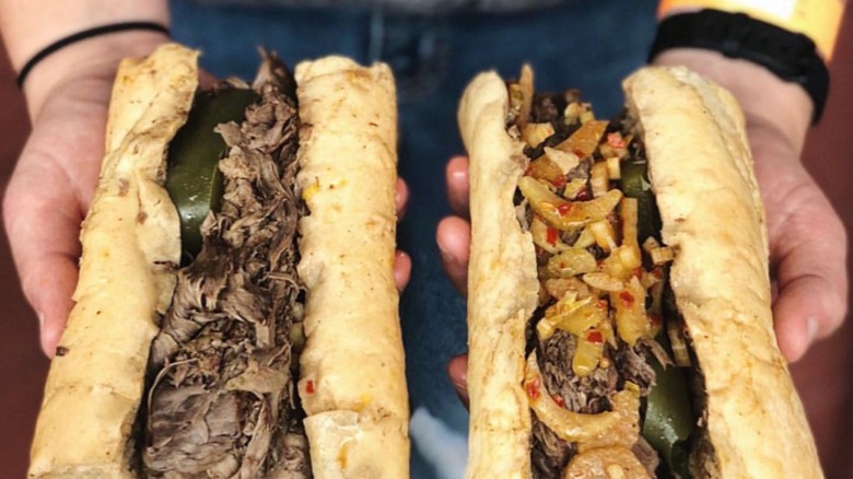 Two Italian beef sandwiches, one with giardiniera and one without