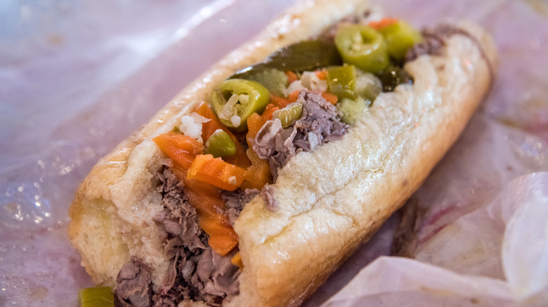 an Italian beef sandwich with giardiniera and peppers