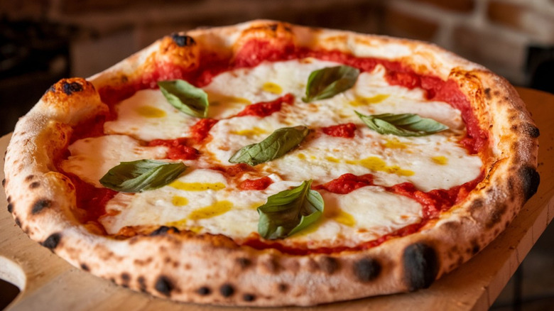 A mouthwatering pizza margherita with perfectly charred crust