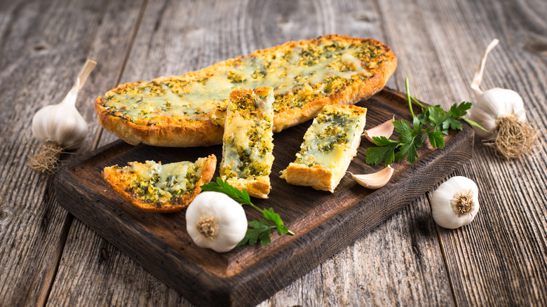 Garlic bread on cutting board