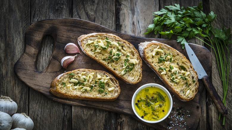 Garlic bread on cutting board