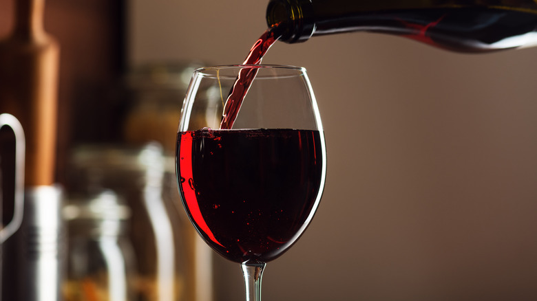 Pouring a glass of red wine