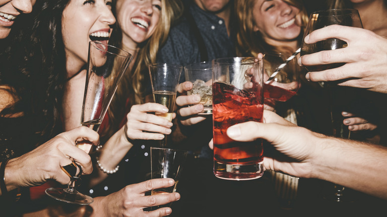 Friends with drinks in hand