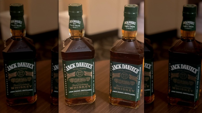 Two bottles of Jack Daniel's Discontinued green label Old No. 7 Whiskey.