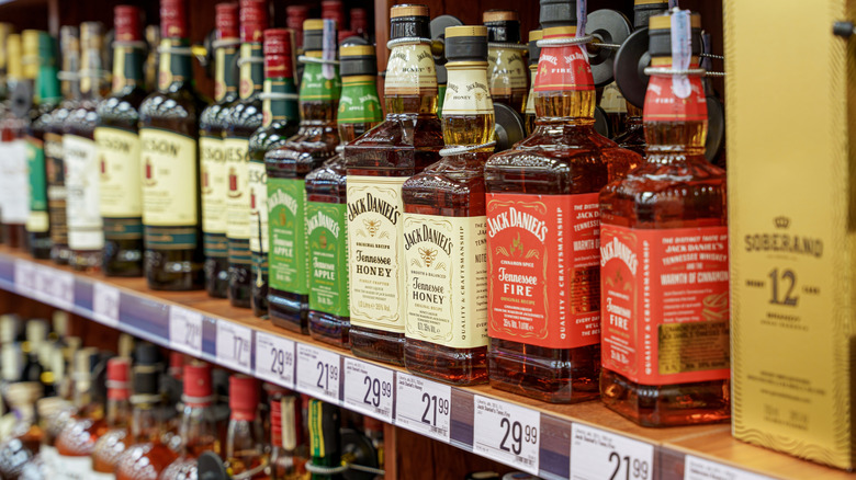 Bottles of Jack Daniel's whiskey lined on a shelf