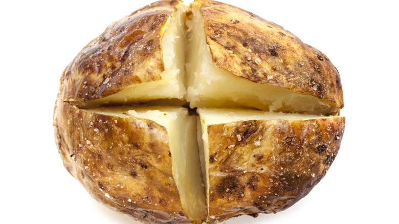 Plain baked potato cut horizontally and vertically