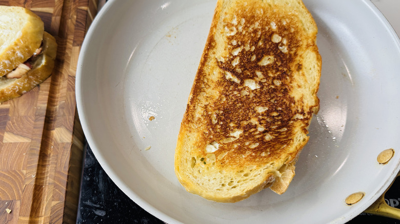Golden brown sandwich in skillet