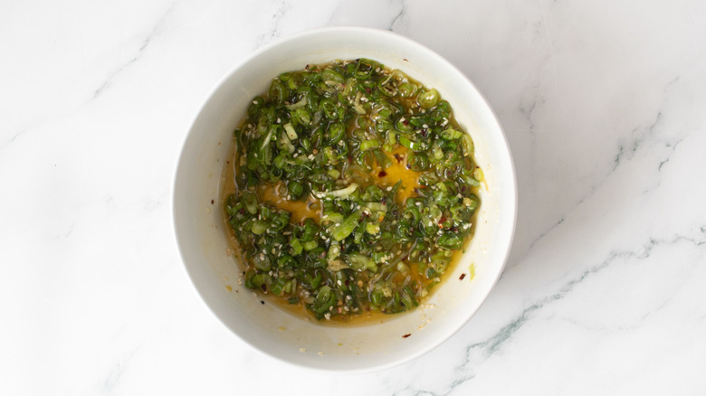 scallion drizzle combined in a bowl