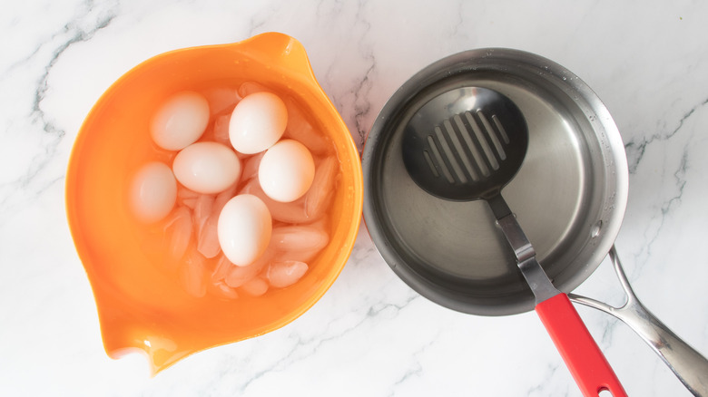 cooked eggs in an ice bath