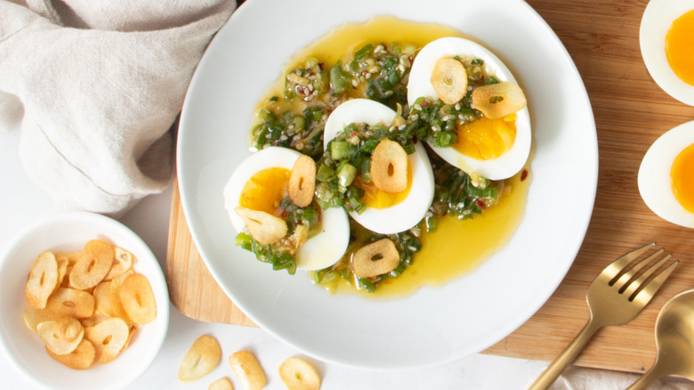 fried garlic and scallion drizzle over jammy eggs