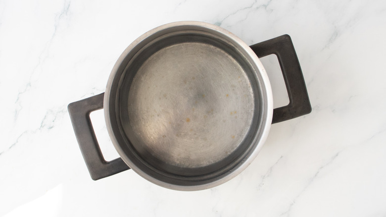 A large saucepan filled with water.