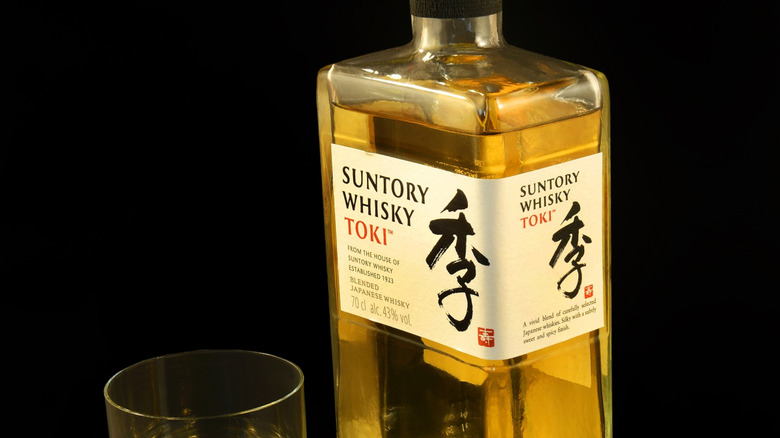 Bottle of Toki whisky with glass