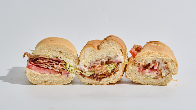 Jimmy John's, Jersey Mike's, and Subway BLTs on a table