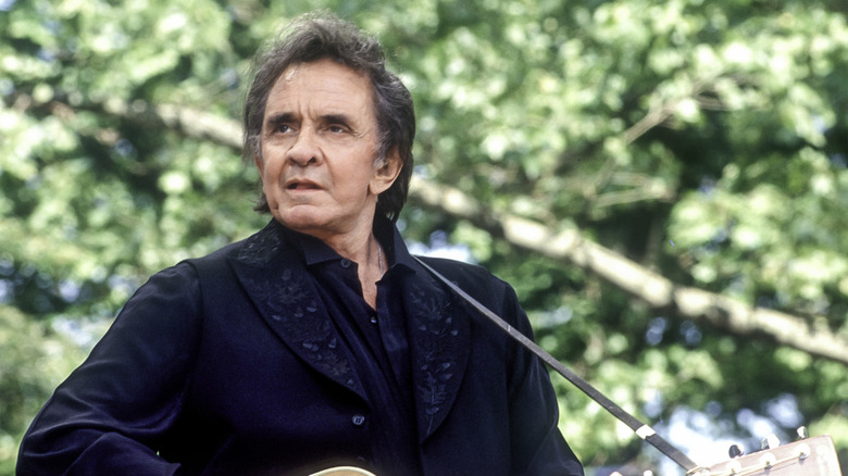 Johnny Cash playing the guitar