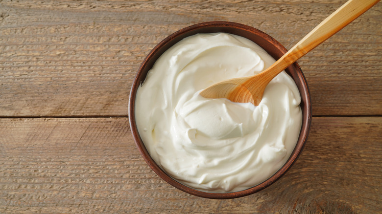 Sour cream in a bowl with a spoon
