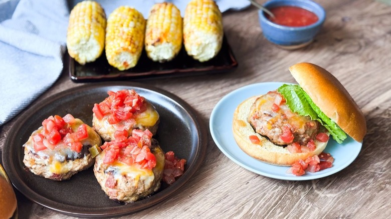 Juicy 3-ingredient tex-mex turkey burgers on serving platter and plate with lettuce and bun