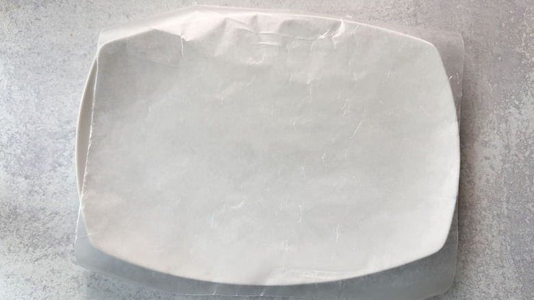 Rectangular white platter lined with waxed paper