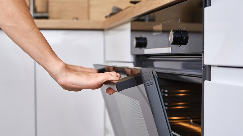 Hand opening oven door