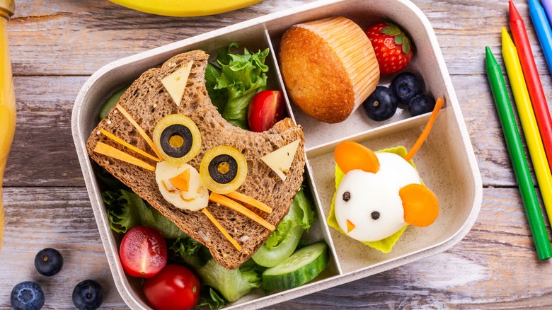 Character bento box with fresh fruit and vegetables