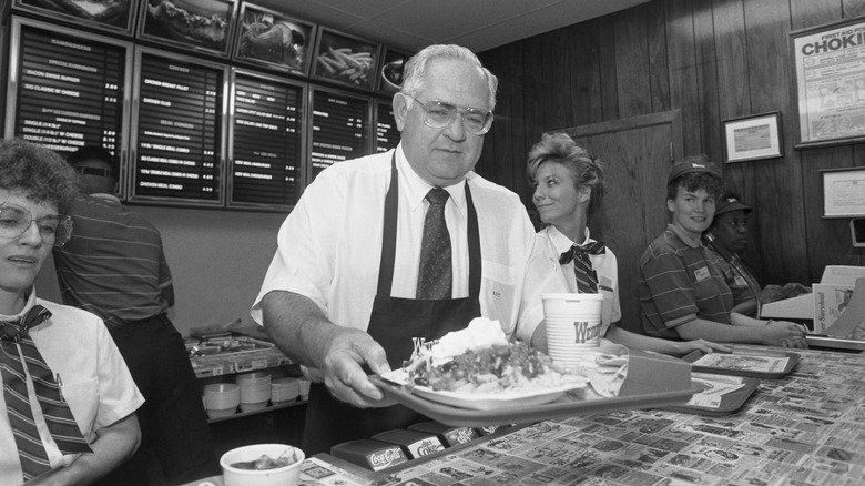 Dave Thomas working the counter at a Wendy's