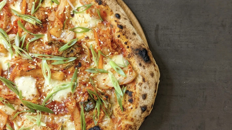 Close up of kimchi on a pizza