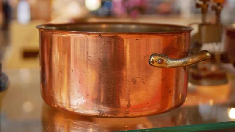 copper soup pot sitting on a counter