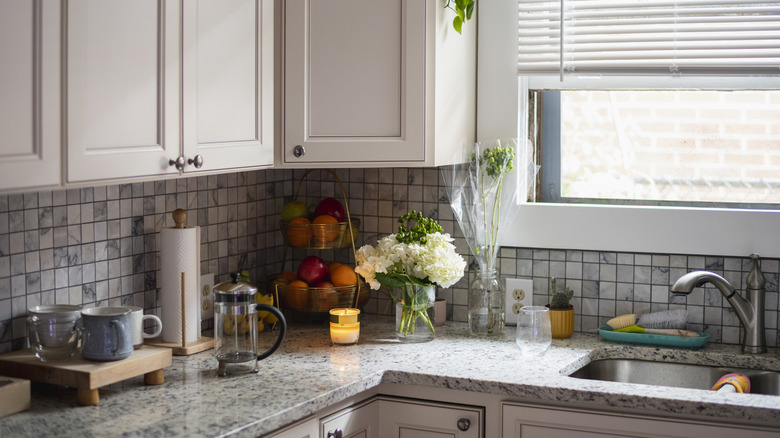 kitchen backsplash with sink and window