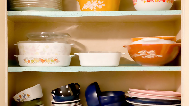Cabinet of vintage Pyrex and dishes