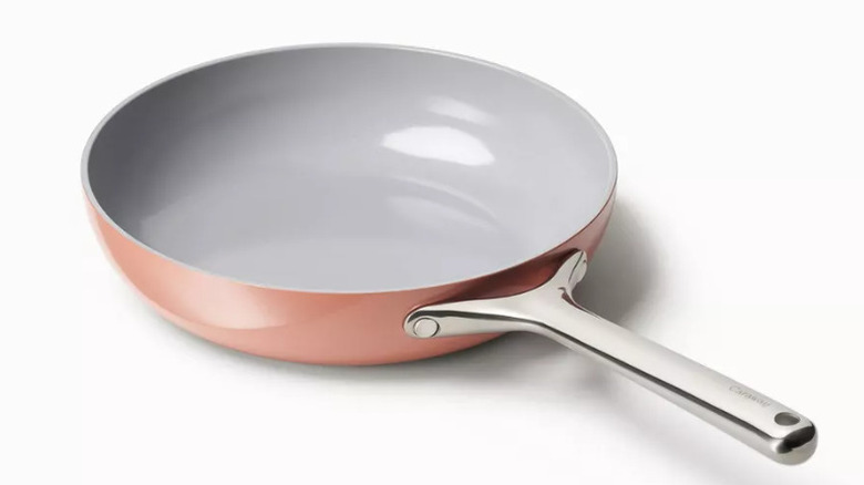 Caraway Home Ceramic Non-Stick Frying Pan on a white surface