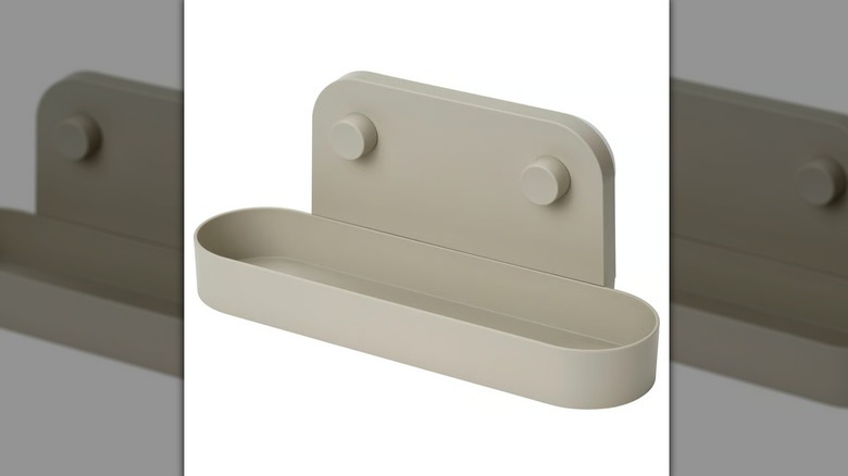 Ikea ÖBONÄS wall shelf with suction cup on a white background