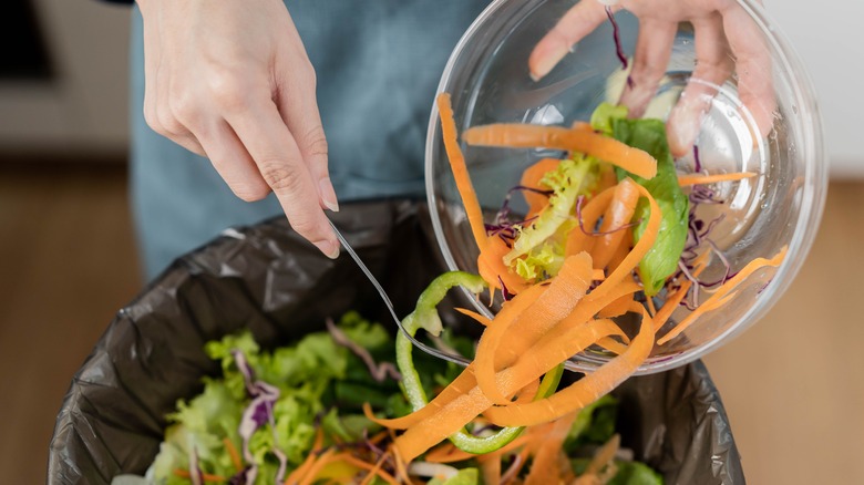 Tossing out vegetable scraps