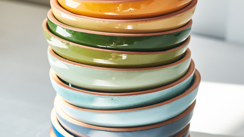 brightly colored stack of shallow ceramic bowls