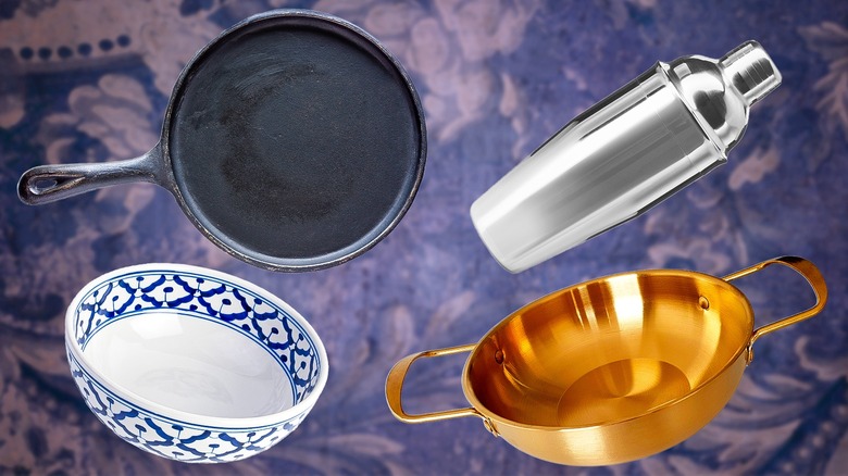 Variety of kitchen tools floating on blue background