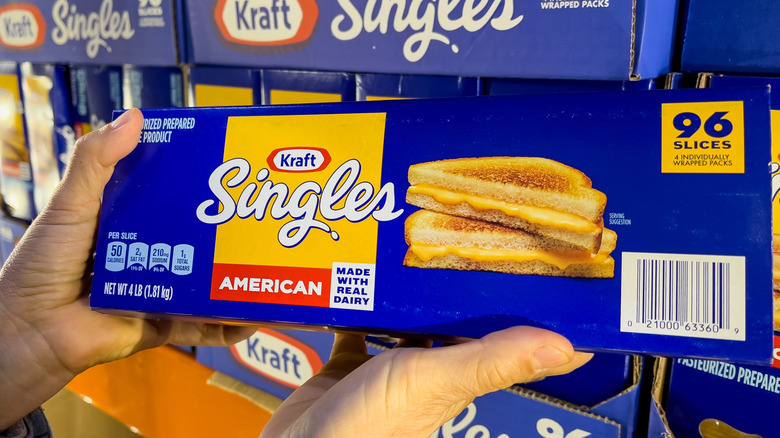 hands holding package of Kraft singles