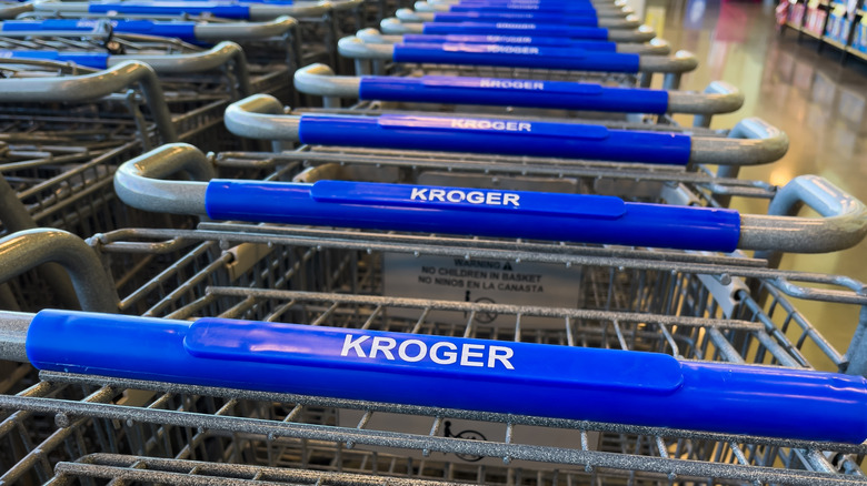 A line of Kroger shopping carts