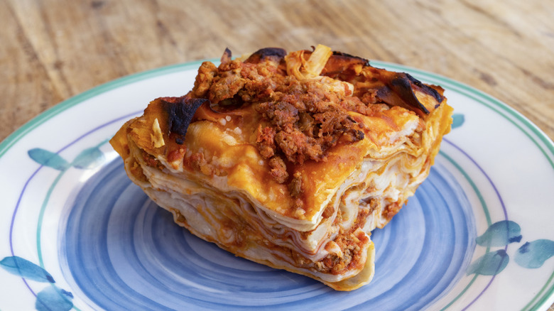 Baked lasagna with layers of pasta, Bolognese, and b&eacute;chamel