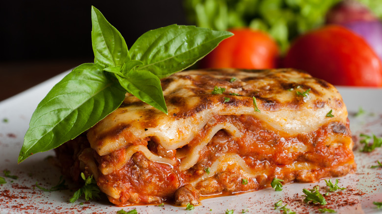 Plated lasagna with herb garnish
