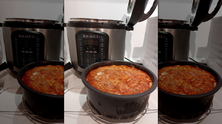 Cooked lasagna in an Instant Pot's steel inner pot