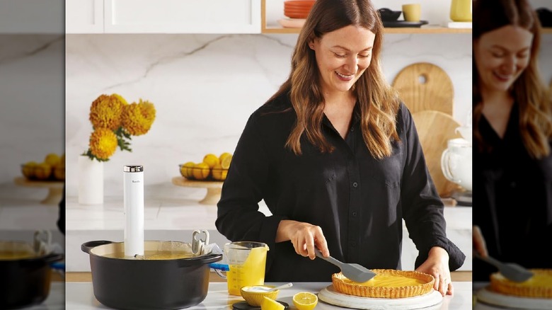 Woman making a lemon curd tart using Breville Joule turbo sous vide machine