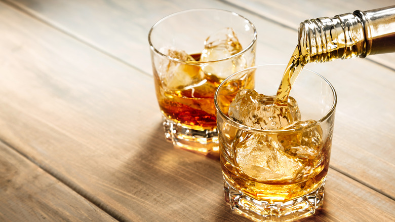 Whiskey being poured into glasses
