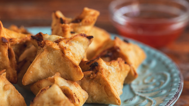 square crab rangoon on a blue ceramic place
