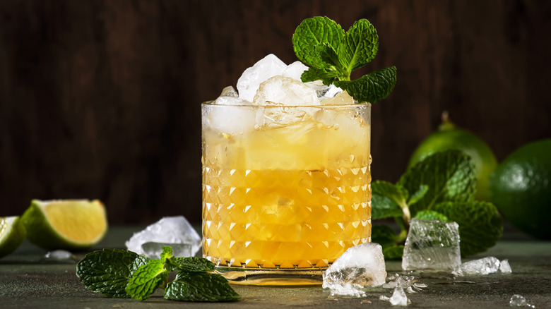 Mai Tai cocktail with rum, liqueur, syrup, lime juice, mint and crushed ice.