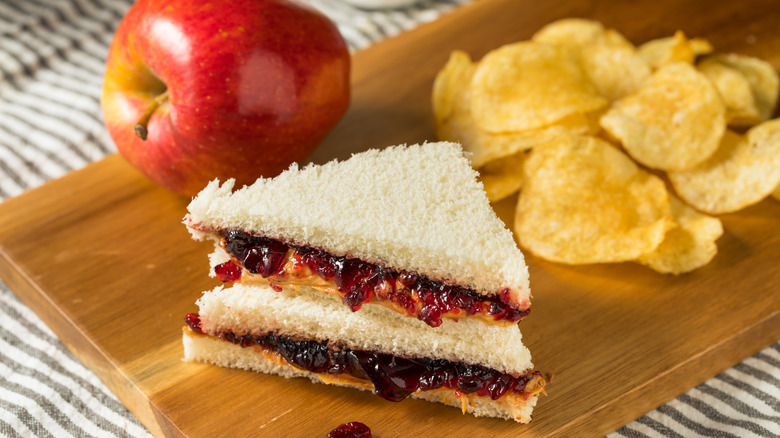 sliced peanut butter and jelly sandwich and chips