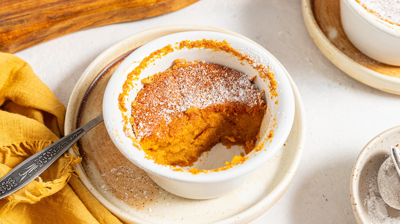 Ramekin with carrot souffle eaten half way