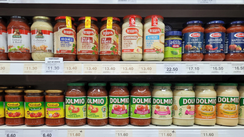 Assorted pasta sauces on store shelves